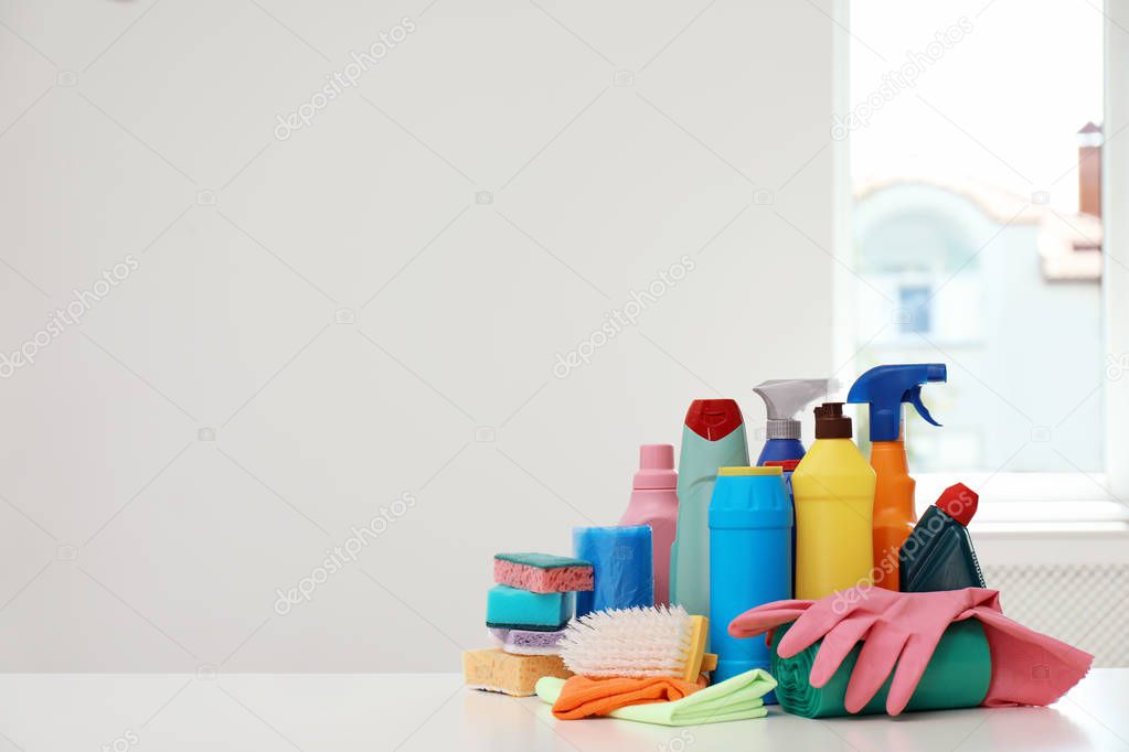 Set of cleaning supplies on table indoors
