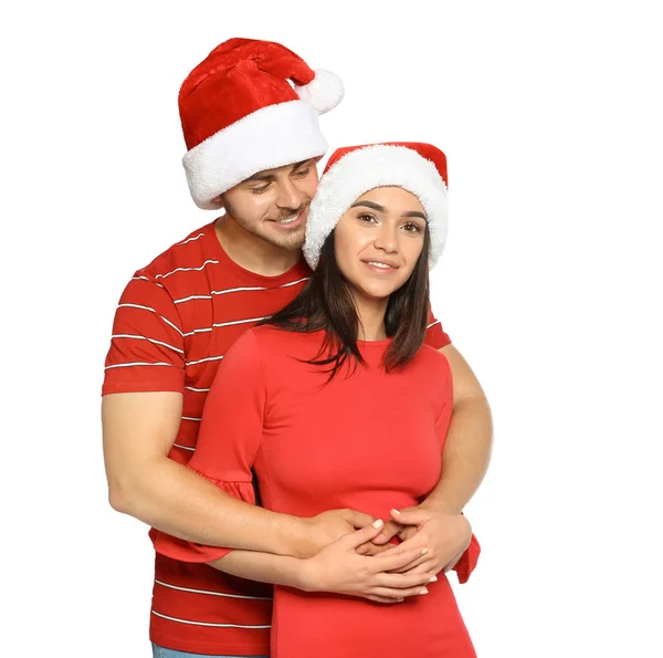 Νεαρό Ζευγάρι Ευτυχισμένο Καπέλα Santa Άσπρο Φόντο Χριστουγεννιάτικη Γιορτή — Φωτογραφία Αρχείου