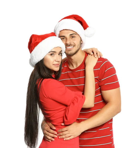 Jovem Casal Feliz Com Chapéus Papai Noel Fundo Branco Celebração — Fotografia de Stock