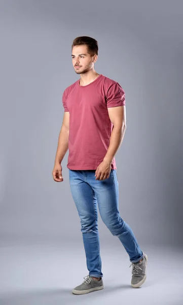 Young Man Stylish Jeans Grey Background — Stock Photo, Image