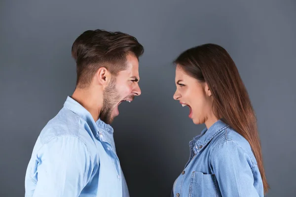 Young Couple Having Argument Grey Background Relationship Problems — Stock Photo, Image