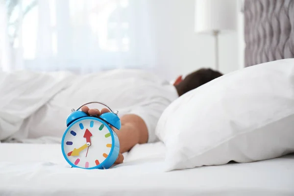 Man Turning Alarm Clock Bedroom — Stock Photo, Image