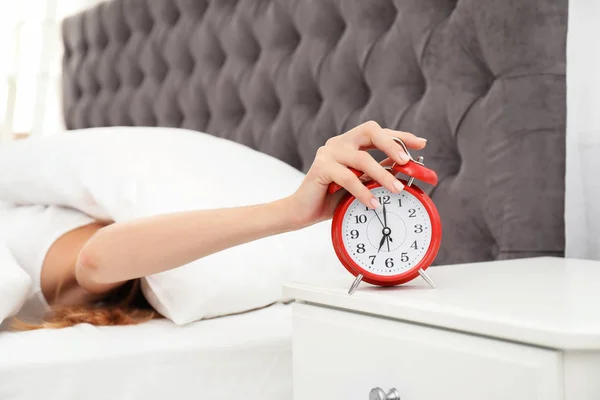 Woman Turning Alarm Clock Bedroom — Stock Photo, Image