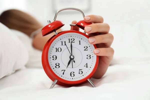 Woman Turning Alarm Clock Bedroom Stock Photo