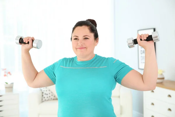 Overweight Woman Doing Exercise Dumbbells Home Royalty Free Stock Images