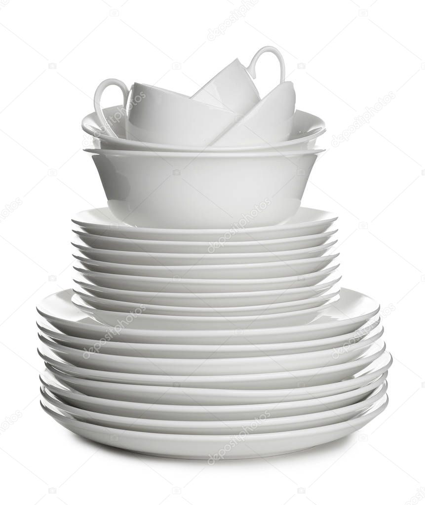 Stack of ceramic dishware on white background