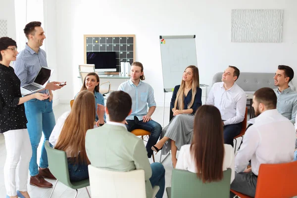 Young people having business training in office