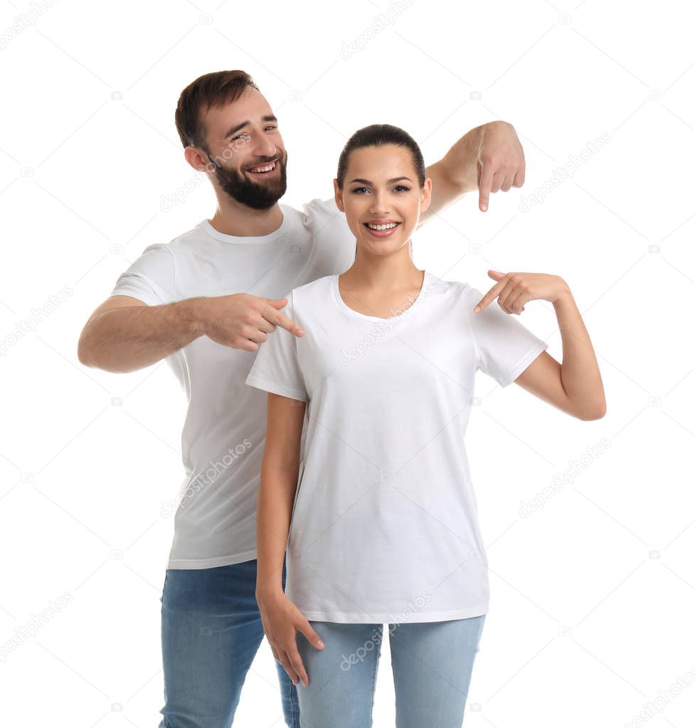 Young couple in t-shirts on white background. Mockup for design