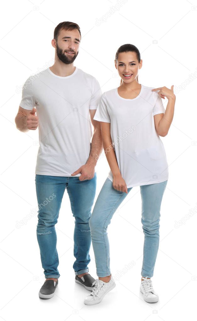 Young couple in t-shirts on white background. Mockup for design