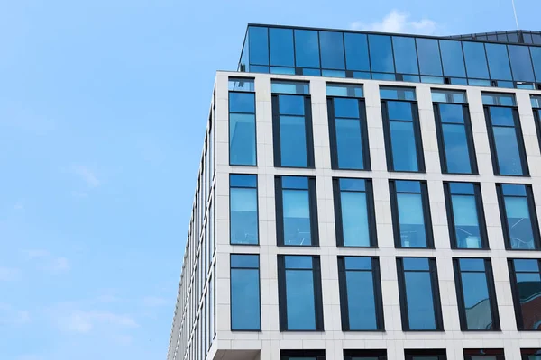 Building with tinted windows, outdoors. Modern architectural design