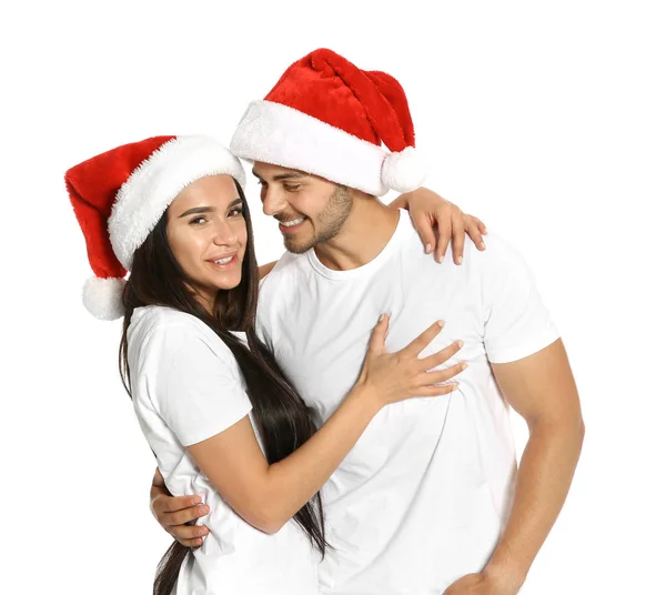 Joven Pareja Feliz Con Sombreros Santa Sobre Fondo Blanco Celebración —  Fotos de Stock