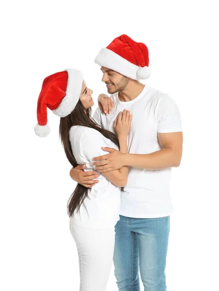 Joven Pareja Feliz Con Sombreros Santa Sobre Fondo Blanco Celebración —  Fotos de Stock