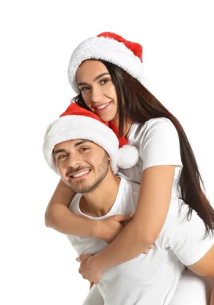 Młoda Para Zadowolony Santa Kapelusze Białym Tle Boże Narodzenie Celebracja — Zdjęcie stockowe