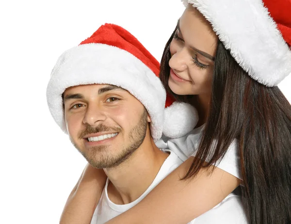Giovane Coppia Felice Con Babbo Natale Cappelli Sfondo Bianco Celebrazione — Foto Stock