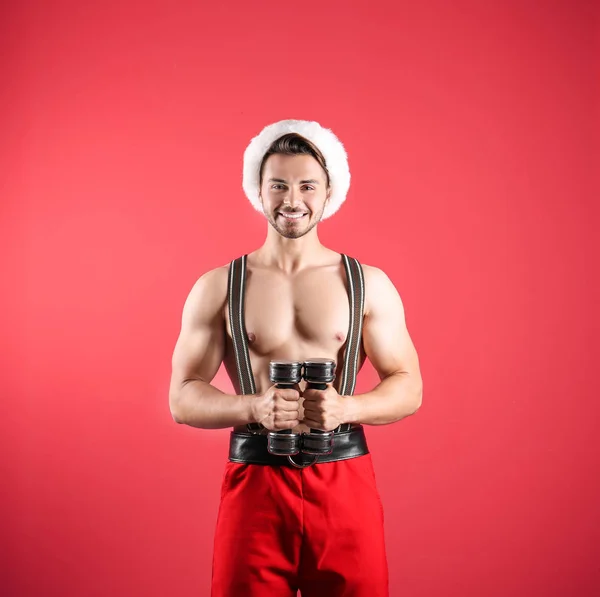 Shirtless Sexy Young Santa Claus Dumbbells Color Background — Stock Photo, Image