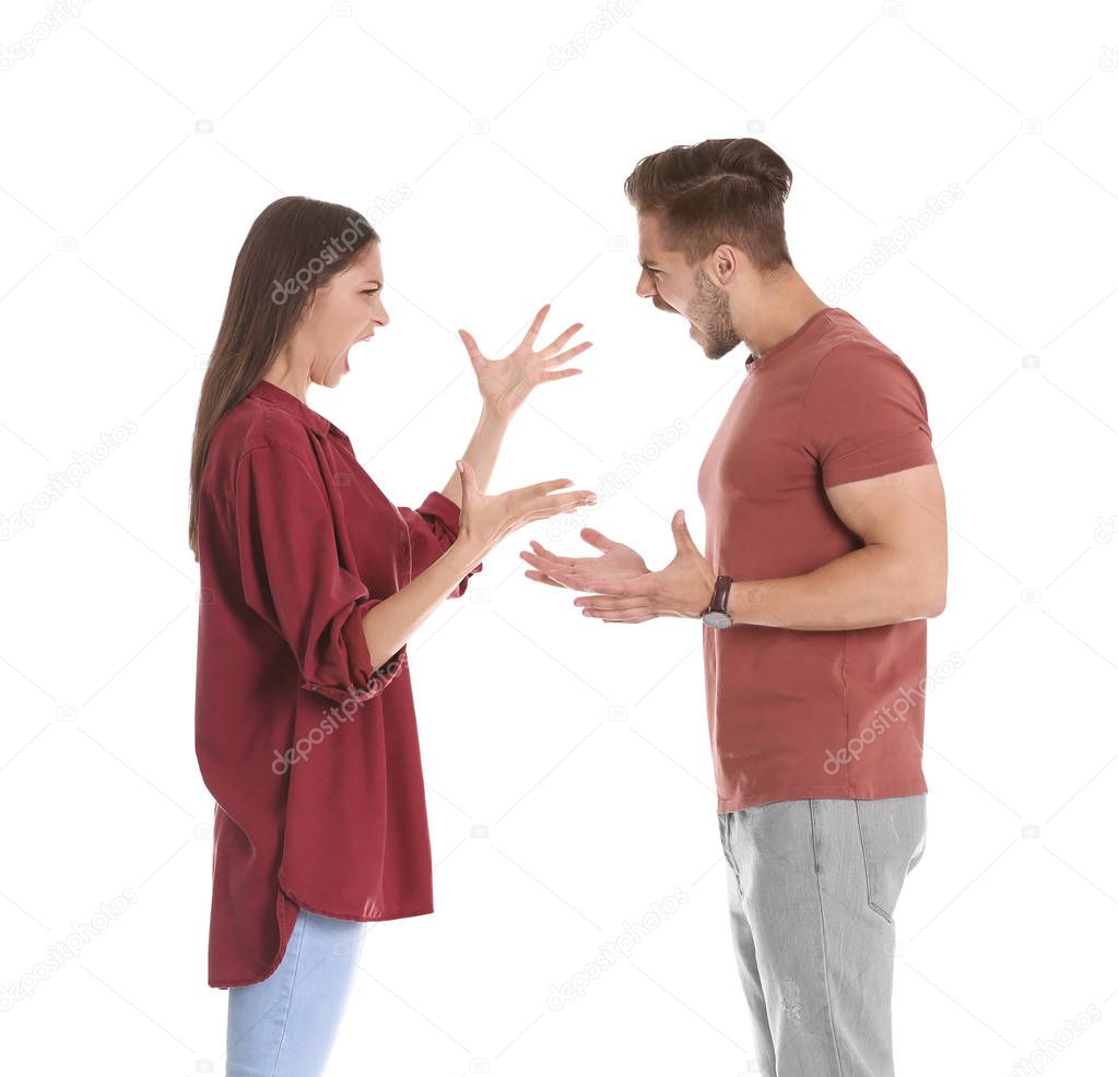Young couple having argument on white background. Relationship problems