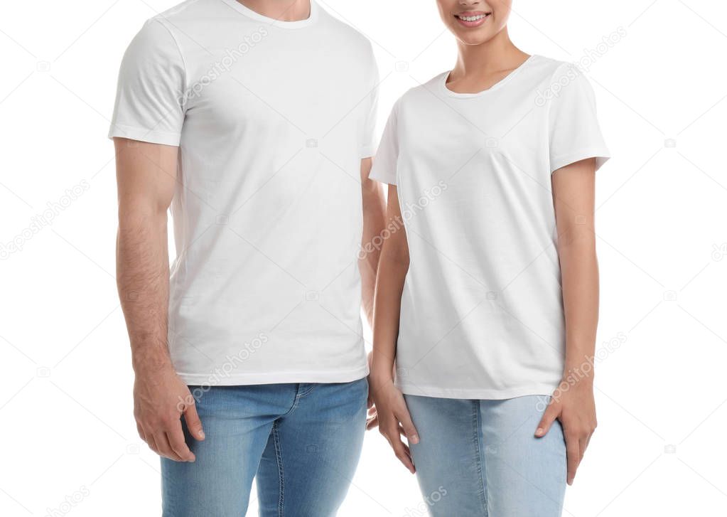 Young couple in t-shirts on white background. Mockup for design