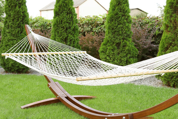 Empty comfortable hammock outdoors on sunny day