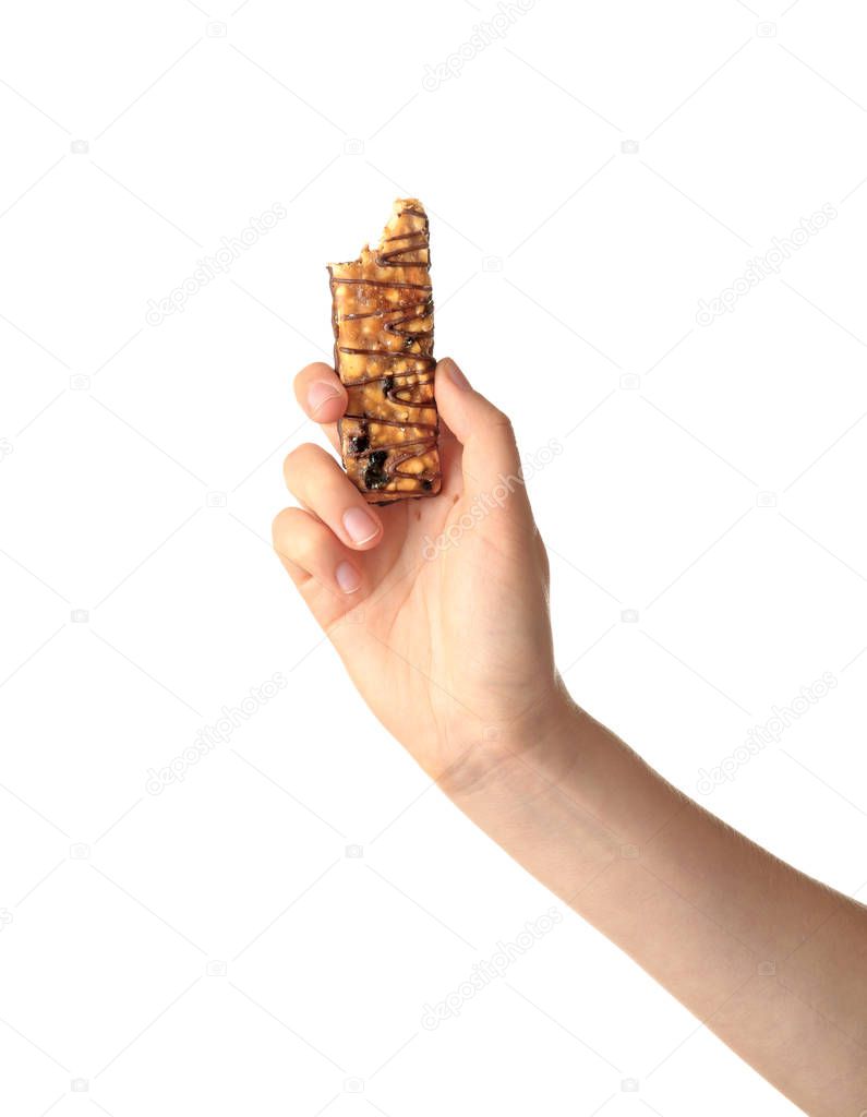 Woman holding grain cereal bar on white background. Healthy snack