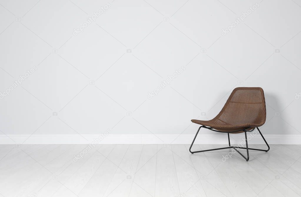 Stylish comfortable armchair indoors. House interior element