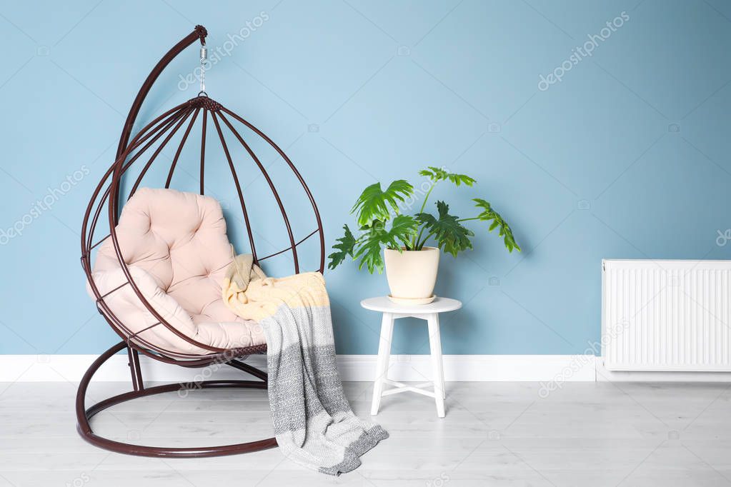 Elegant room interior with stylish comfortable armchair