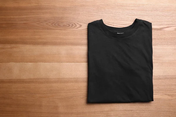 Blank Black Shirt Wooden Background — Stock Photo, Image