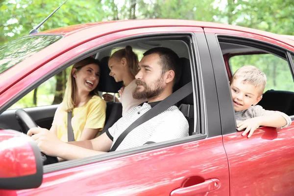 Happy family with children taking road trip together