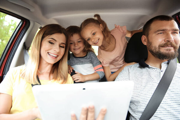 Happy family with children taking road trip together