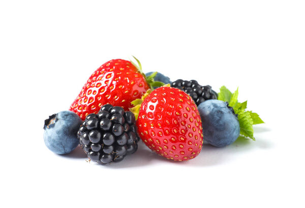 Strawberries, blackberries and blueberries on white background