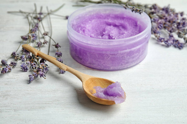 Composition with lavender flowers and natural cosmetic on wooden background