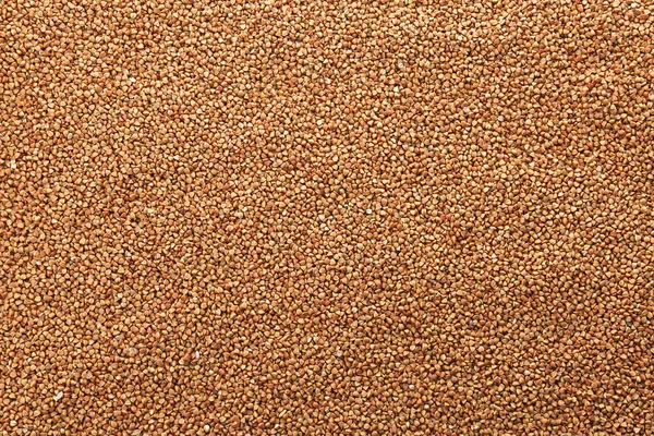 Raw buckwheat as background. Healthy grains and cereals