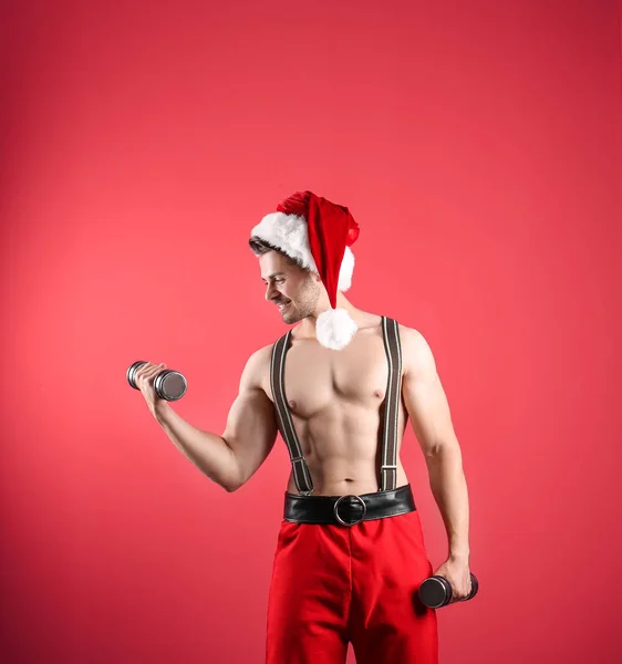 Shirtless Sexy Young Santa Claus Dumbbells Color Background — Stock Photo, Image