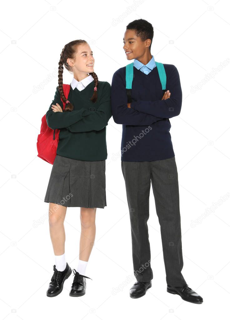 Teenagers in stylish school uniform on white background