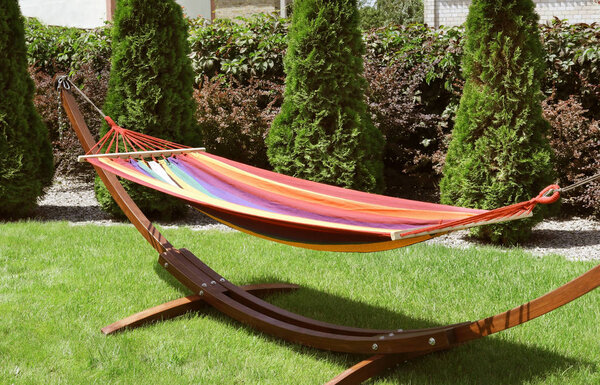 Empty comfortable hammock outdoors on sunny day