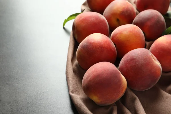 Fresh sweet peaches on table, closeup