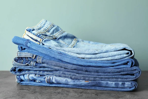 Stack Jeans Table Color Background — Stock Photo, Image