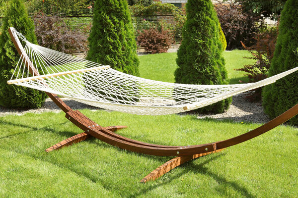 Empty comfortable hammock outdoors on sunny day