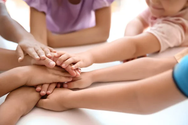 Little Children Putting Hands Together Table Closeup Unity Concept — Stock Photo, Image