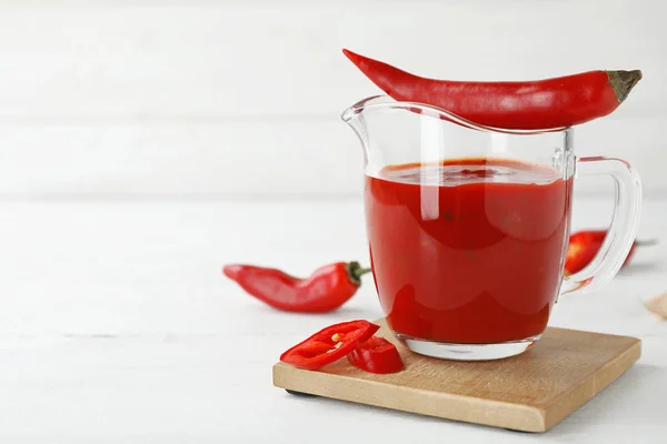 Jug Spicy Chili Sauce Fresh Pepper Light Table — Stock Photo, Image