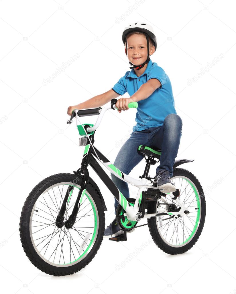 Portrait of cute little boy with bicycle on white background