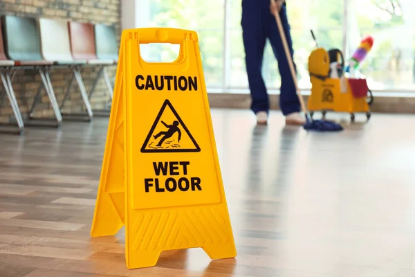 Safety Sign Phrase Caution Wet Floor Blurred Cleaner Background — Stock Photo, Image
