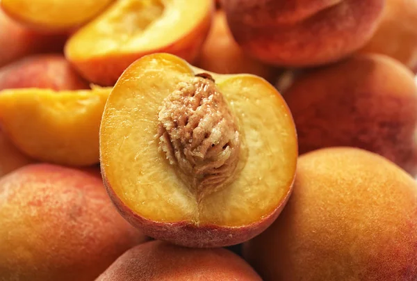 Pile of delicious ripe peaches as background, closeup