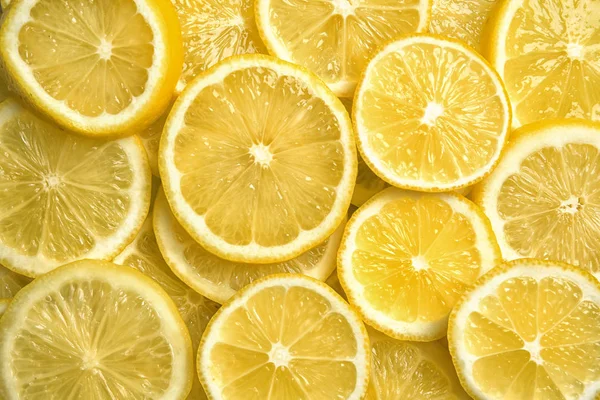 Slices of fresh juicy lemons as background