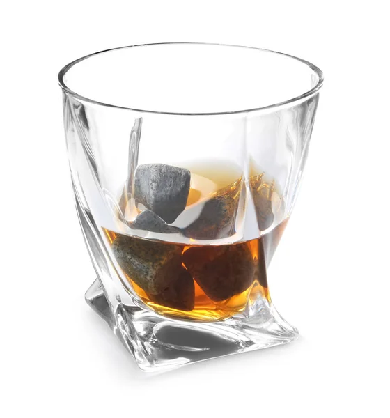 Glass with liquor and whiskey stones on white background