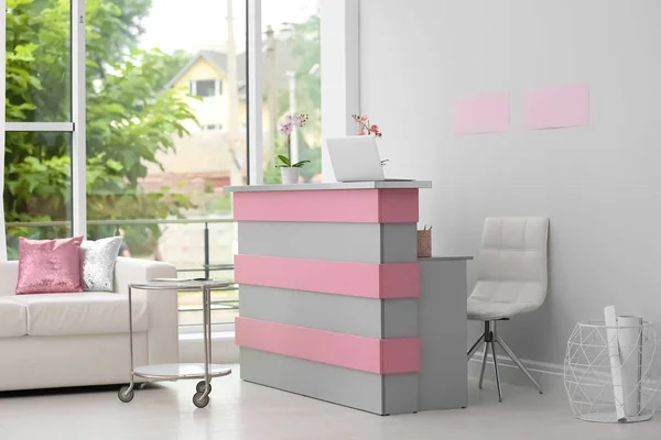 Reception desk in beauty salon. Stylish interior