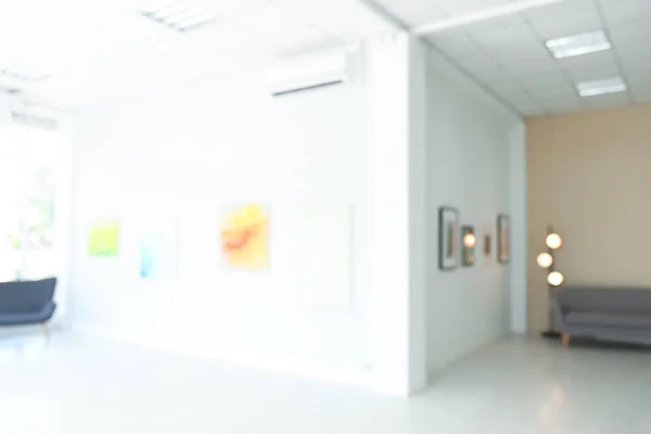 Blurred view of modern art gallery with exhibits