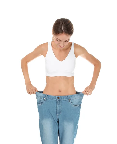 Mladá Štíhlá Žena Staré Velké Džíny Ukazující Její Dieta Výsledky — Stock fotografie