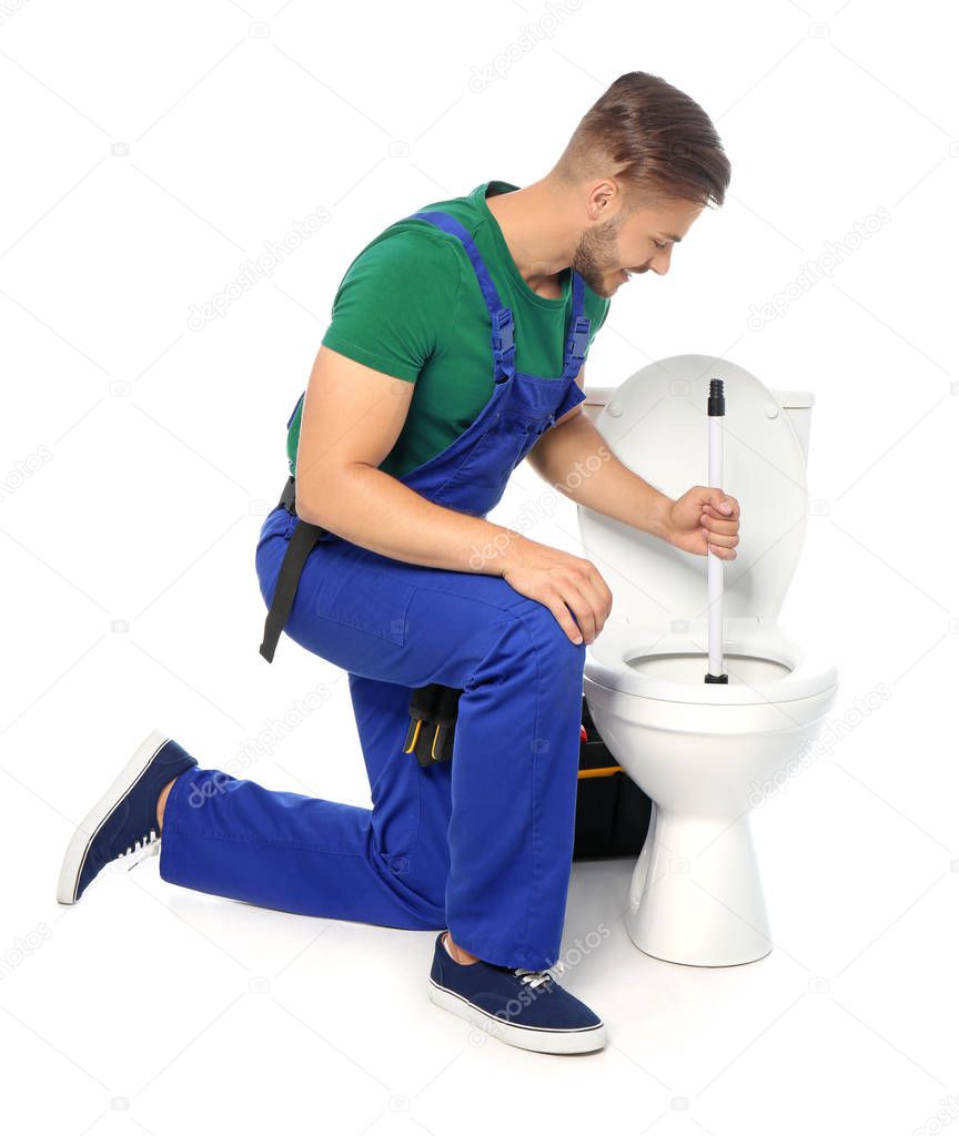 Young man working with toilet bowl, isolated on white