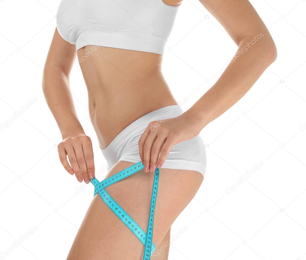Beautiful young woman with measuring tape on white background. Healthy diet