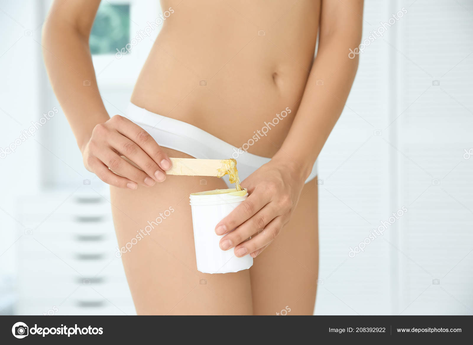 Sexy Young Woman Waxing Bikini Area Indoors — Stock Photo © NewAfrica